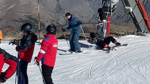 Ski Lift Rider Misses Dismount and Knocks Her Companion Down
