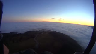Ocean of clouds while paragliding over Carpathian Mountains