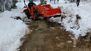 Removing snow from the driveway with our Kubota tractor part #1