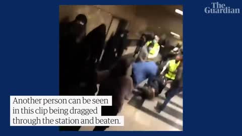 People run for cover as Iranian police open fire during protest at Tehran metro station