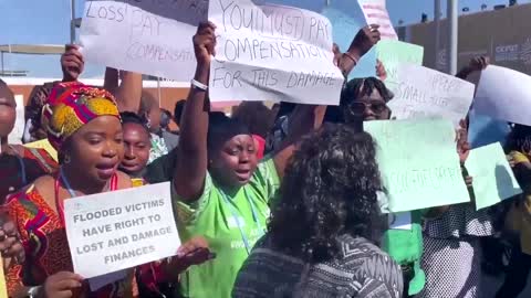 African protesters demand action from COP 27 climate summit.