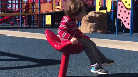 Spinning Toddler Takes A Tumble