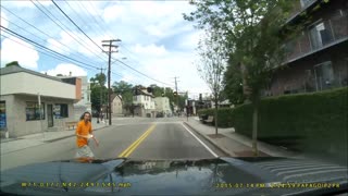 Dash cam footage captures pedestrian's odd behavior