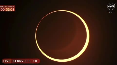 BREAKING: Here comes the rare 'ring of fire' solar eclipse. Sky darkens as the moon covers the sun.