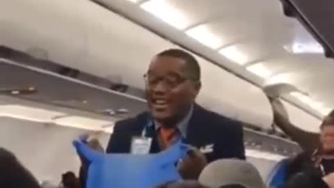 Flight Attendant Sings "Throw Away Your Masks"
