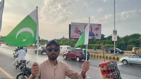 A man with Pakistanis flags on Independence day