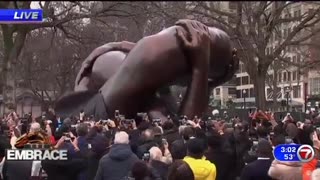 “The Embrace” to honor Martin Luther King - looks like someone’s head is between someones legs
