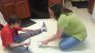 Mom and son have unusual cleaning routine