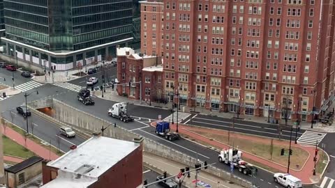 Small Trucker Convoy entering downtown DC / Capitol Hill with police escort