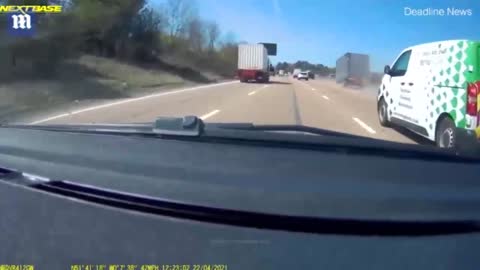 A huge container suddenly detaches from the lorry on a very busy motorway