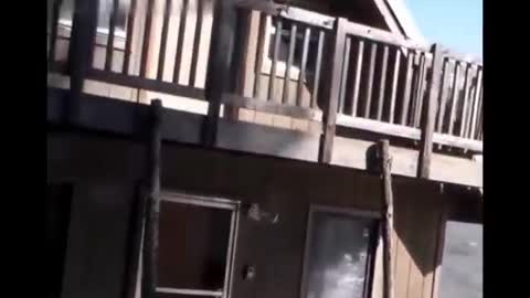 A house along the river in Alaska is washed away by floodwaters