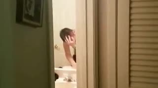 Shirtless drunk man accidentally smacks head in bathroom door