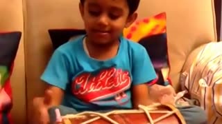 Amazing 3 year old playing the dholak and singing