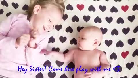 Baby silibings playing and laughing together