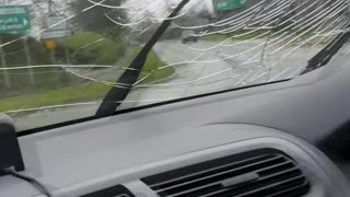 Man Bashes Windshield on Moving Car