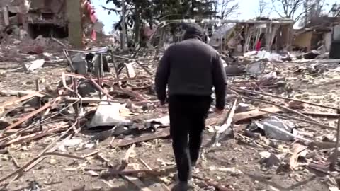 Aftermath of an aerial bombing is seen in the village of Byshiv outside Kyiv on Saturday (March 12)