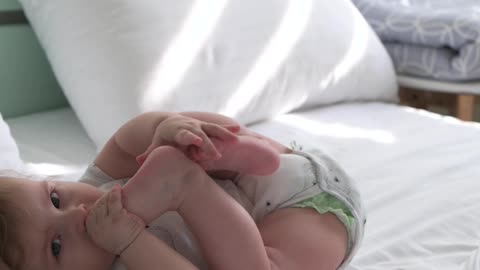 A child eats his feet while he is asleep