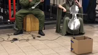 Metal elephant guy musician subway