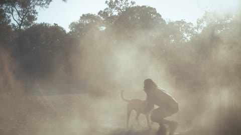 Dog runs to a man