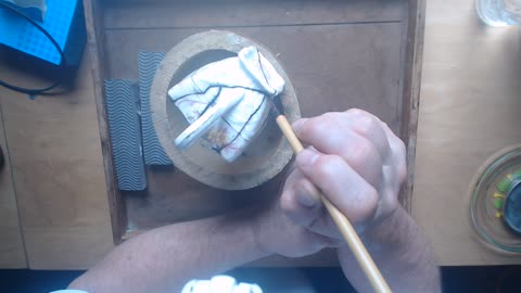 Traditional, lacquer based kintsugi, applying middle lacquer to a creamer.