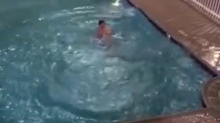 Man jumps from second story into couryard pool
