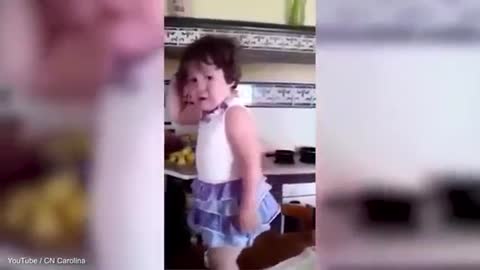 Cute toddler stops crying to strike a pose