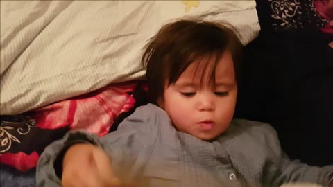 Adorable little girl singing good night songs for daddy