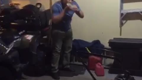 Music country music guy in blue sweater throws dark and hits beer can on wall