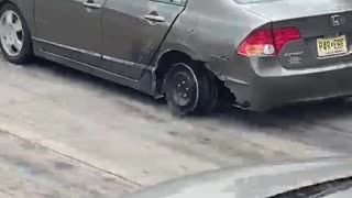 Car Drives Along Interstate on the Rim