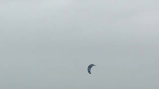 Kitesurfer Catches Huge Air During Storm