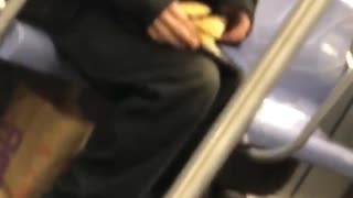Man eating pancakes on train