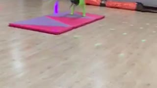 Neon green backflip purple foam pad falls on floor gymnastics girl
