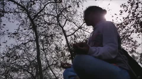 Relaxing meditation near a river stream