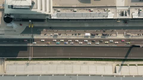 Aerial drone footage of racecars on speedway