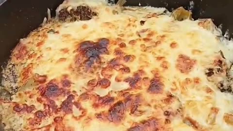 Vegetables gratinated with cheese in the Dutch oven