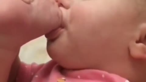 baby sucking different finger