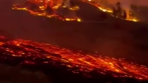 As night falls lava flows from the La Palma volcano 9-19-2021