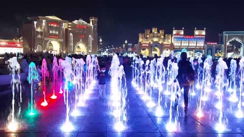 Children play with water and music