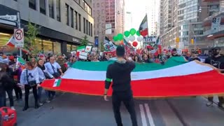 Over 20,000 people march in downtown Toronto to show solidarity.