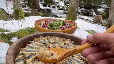 Cooking anchovy fish pilaf on a tile