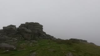 A tor in the mist in Dartmoor