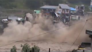 devastating flood destroying hotel building in Pakistan.