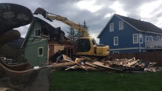 Excavator destroys home