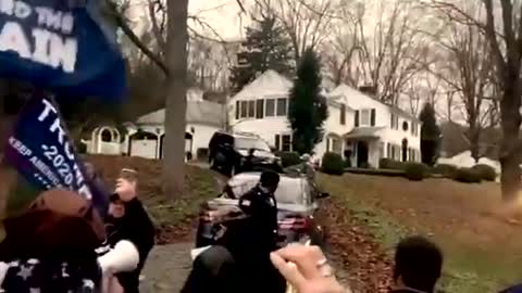 Cuomo's house and sings "We will rock you"