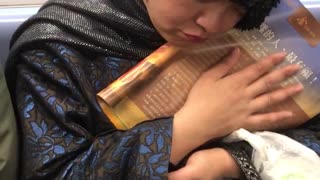 Woman cuddles and caresses book