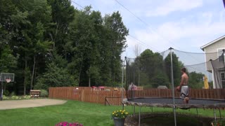 Two Basketballs Enter The Hoop In Unison Mid Trampoline Stunt