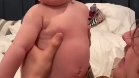 Baby and parents having fun