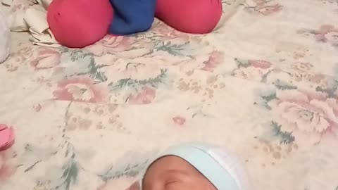 Cute doll singing a song for newborn little angle sister