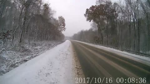 Car Slides on Snow and Gets Hit by Semi