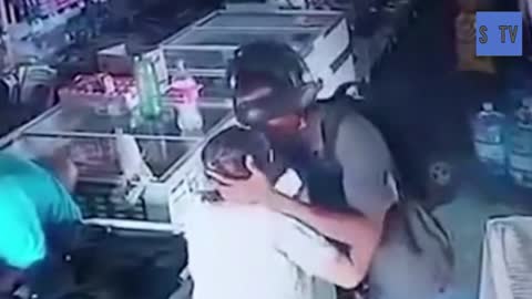Armed robber kisses elderly woman